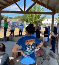 Volunteers listening to a coach