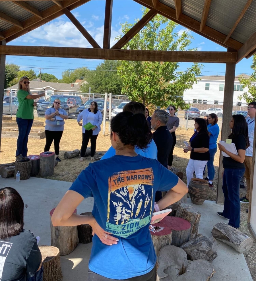 Volunteers listening to a coach
