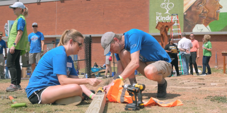 Cox volunteers building bench