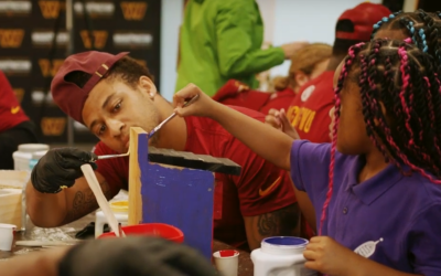 Washington commanders painting with student