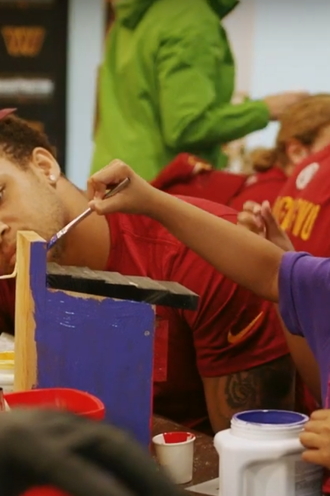 Washington commanders painting with student