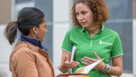 Luisa Aviles talking with teacher