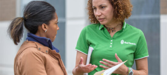 Luisa Aviles talking with teacher