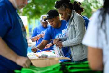 COX Event - Volunteers handing out supplies