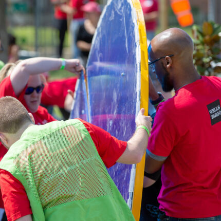 Well Fargo Event - Volunteers moving outdoor lab