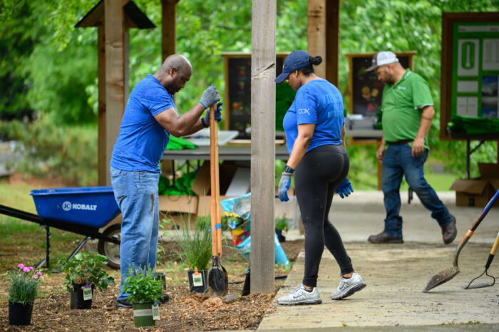 COX Event - Volunteers shoveling in garden